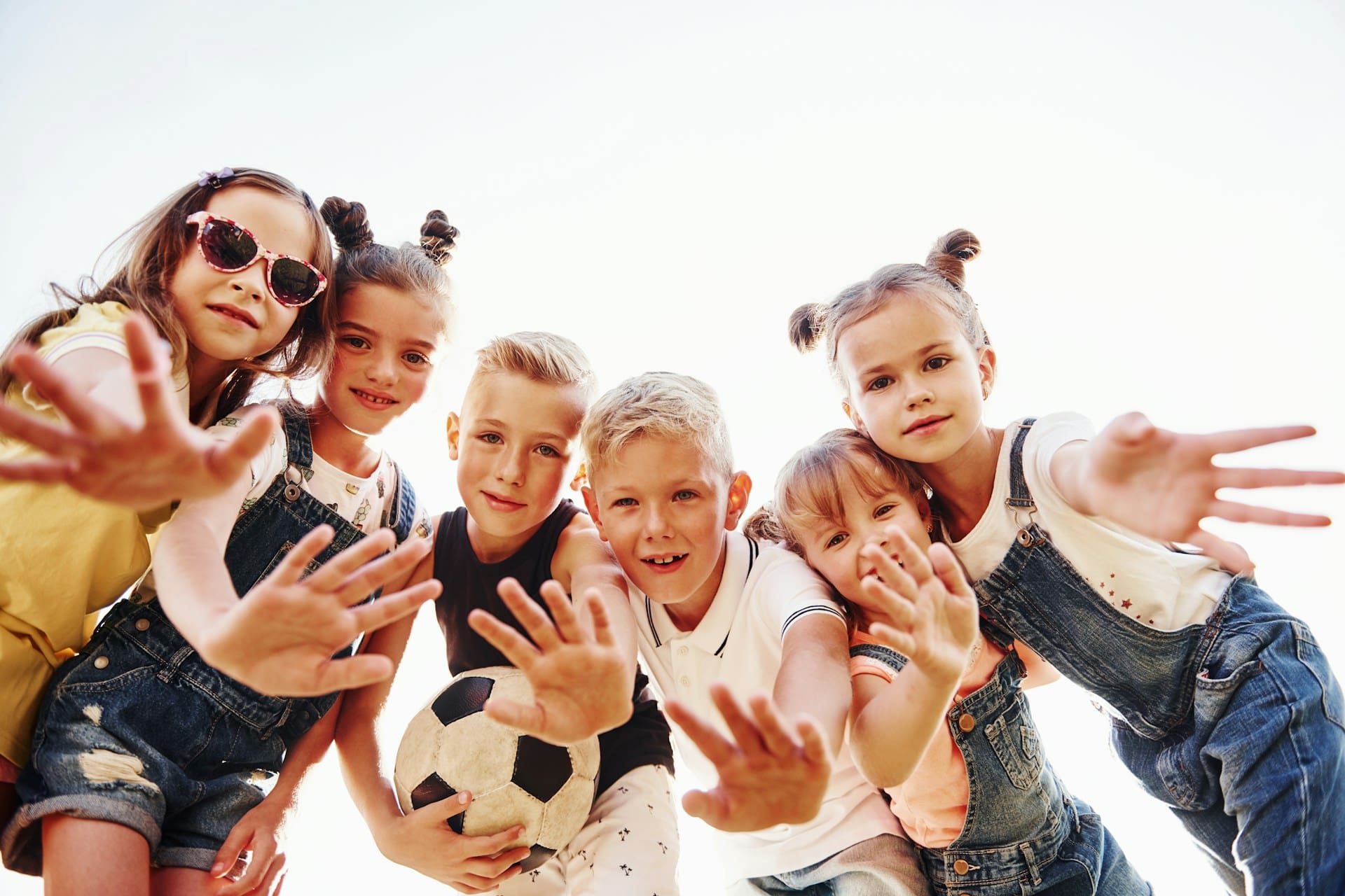 Six children smiling at a camera