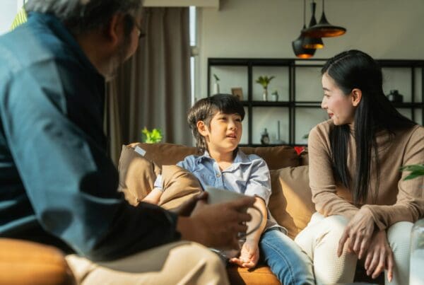 Parents discussing consent with son