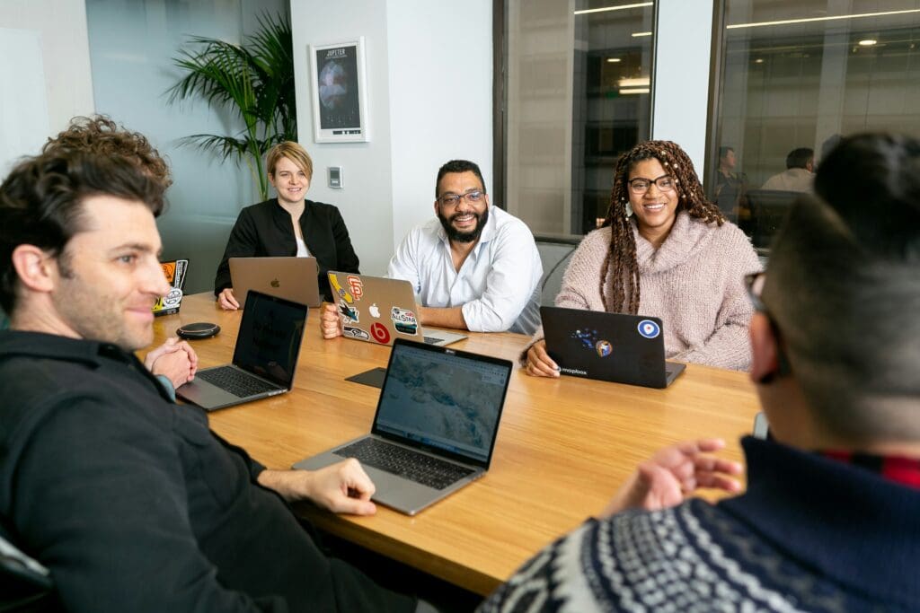 Group of employees working around a table